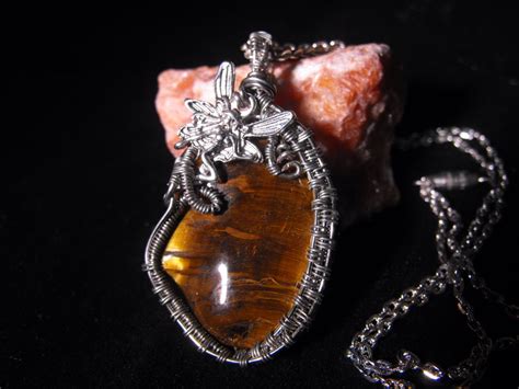 Practical magic necklace with tiger eye pendant